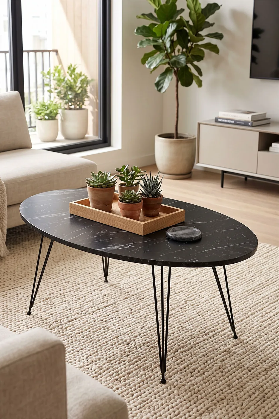 Table basse ovale à pieds en fil - effet marbre noir